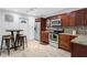 Well-appointed kitchen featuring stainless steel appliances, granite countertops, and ample cabinet space at 2916 W Crest Ave, Tampa, FL 33614