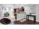 Modern kitchen with dark wood cabinetry, stainless steel appliances, and a convenient breakfast bar at 2916 W Crest Ave, Tampa, FL 33614