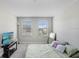 Bedroom with carpet, natural light from the window, a TV on a console, and a comfortable bed at 29901 Southwell Ln, Wesley Chapel, FL 33543