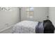 Cozy bedroom featuring natural light from the window, carpeting, and modern decor at 29901 Southwell Ln, Wesley Chapel, FL 33543