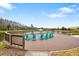 Lakeside deck with seating and a fountain at 29901 Southwell Ln, Wesley Chapel, FL 33543