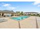 Community pool with plenty of lounge chairs for relaxing at 29901 Southwell Ln, Wesley Chapel, FL 33543