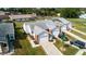Aerial view of homes with manicured lawns, driveways, and landscaping at 3010 Beecher E Dr # A, Palm Harbor, FL 34683