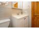 A clean bathroom with a white vanity and tiled walls at 3010 Beecher E Dr # A, Palm Harbor, FL 34683
