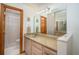 Bright bathroom featuring tile flooring and a large mirror at 3010 Beecher E Dr # A, Palm Harbor, FL 34683