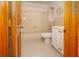Full bathroom with tiled floors and a shower-tub combo at 3010 Beecher E Dr # A, Palm Harbor, FL 34683