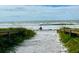 Scenic beach access with sandy path and ocean view at 3010 Beecher E Dr # A, Palm Harbor, FL 34683
