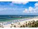 Stunning beach panorama featuring white sand, clear blue waters, and palm trees at 3010 Beecher E Dr # A, Palm Harbor, FL 34683
