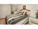 Comfortable bedroom featuring a ceiling fan and bedside table at 3010 Beecher E Dr # A, Palm Harbor, FL 34683