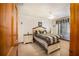Cozy bedroom featuring a ceiling fan and comfortable bedding at 3010 Beecher E Dr # A, Palm Harbor, FL 34683