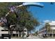 View of the Clearwater entrance sign by street with buildings under a clear blue sky at 3010 Beecher E Dr # A, Palm Harbor, FL 34683