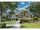 Community clubhouse featuring lush landscaping and a well-maintained exterior at 3010 Beecher E Dr # A, Palm Harbor, FL 34683