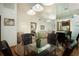 A dining area features a glass top table, leather chairs, and elegant light fixtures at 3010 Beecher E Dr # A, Palm Harbor, FL 34683