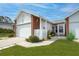 Attractive home exterior with a well-manicured lawn and a cozy front entrance at 3010 Beecher E Dr # A, Palm Harbor, FL 34683