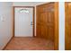 Inviting foyer with tile flooring and a classic white door at 3010 Beecher E Dr # A, Palm Harbor, FL 34683