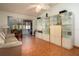Bright living room features a large glass display case and sliding glass doors to a lanai at 3010 Beecher E Dr # A, Palm Harbor, FL 34683