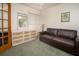 Comfortable living room with a sofa, dresser, and plenty of natural light at 3010 Beecher E Dr # A, Palm Harbor, FL 34683