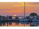 Picturesque marina view with boats docked as the sun sets, painting the sky in warm hues at 3010 Beecher E Dr # A, Palm Harbor, FL 34683