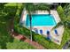 Relaxing community pool surrounded by lush landscaping and comfortable lounge chairs at 3010 Beecher E Dr # A, Palm Harbor, FL 34683
