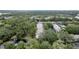Overhead image of the building surrounded by trees and a tranquil pond at 3038 Eastland Blvd # F102, Clearwater, FL 33761