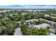 An aerial view showcasing the building within a lush, green community at 3038 Eastland Blvd # F102, Clearwater, FL 33761