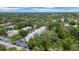 Bird's eye view of the building with beautiful trees and community pool at 3038 Eastland Blvd # F102, Clearwater, FL 33761