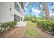 Backyard patio, small bushes, and lots of green space at 3038 Eastland Blvd # F102, Clearwater, FL 33761
