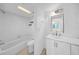 Clean bathroom featuring a shower-tub combo, updated vanity, and modern fixtures at 3038 Eastland Blvd # F102, Clearwater, FL 33761