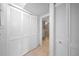 Hallway showing the linen and utility closets plus access to the full bath at 3038 Eastland Blvd # F102, Clearwater, FL 33761