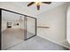 View of living area through sliding doors, featuring tile floors and bar seating at 3038 Eastland Blvd # F102, Clearwater, FL 33761
