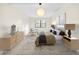 The main bedroom is spacious and includes furniture for staging purposes at 3038 Eastland Blvd # F102, Clearwater, FL 33761
