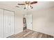 Vacant bedroom featuring a ceiling fan, a closet, and wood-look flooring at 307 Francis Dr, Apollo Beach, FL 33572