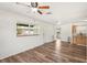 Open-concept living area with modern wood-look flooring and abundant natural light at 307 Francis Dr, Apollo Beach, FL 33572