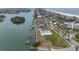 Aerial view of property showcasing the community pool, boat docks, and proximity to the beach, providing a comprehensive overview at 3200 Gulf Blvd # 202, St Pete Beach, FL 33706