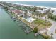 Aerial view of the beachside condos, pool, and private boat slips, providing waterfront living at 3200 Gulf Blvd # 202, St Pete Beach, FL 33706
