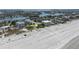 Expansive aerial view showcasing the beachfront property's prime location near the sandy shoreline at 3200 Gulf Blvd # 202, St Pete Beach, FL 33706