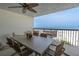 Relaxing balcony with outdoor seating provides breathtaking ocean views, perfect for enjoying seaside living at 3200 Gulf Blvd # 202, St Pete Beach, FL 33706