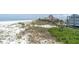 Stunning beachfront property boasting panoramic views of the ocean, sand, and cityscape at 3200 Gulf Blvd # 202, St Pete Beach, FL 33706