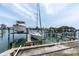 View of private boat lift and dock, perfect for waterfront living and enjoying boating activities at 3200 Gulf Blvd # 202, St Pete Beach, FL 33706