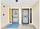 Building entrance featuring secure doors, a welcoming mat, and stylish accents, showcasing attention to detail and security at 3200 Gulf Blvd # 202, St Pete Beach, FL 33706