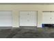 Attached garage providing secure parking and storage space for residents at 3200 Gulf Blvd # 202, St Pete Beach, FL 33706