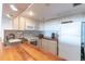 Functional kitchen with wood countertops, white appliances, and ample cabinet space at 3200 Gulf Blvd # 202, St Pete Beach, FL 33706
