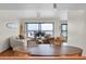 Coastal living room with ocean view, surfboard decor, and comfortable seating at 3200 Gulf Blvd # 202, St Pete Beach, FL 33706