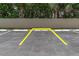 Close-up of parking space in an open parking lot, conveniently marked for easy access at 3200 Gulf Blvd # 202, St Pete Beach, FL 33706