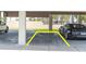 Assigned parking space in covered parking garage, providing convenient and secure parking at 3200 Gulf Blvd # 202, St Pete Beach, FL 33706