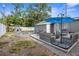 Spacious backyard featuring a fire pit, outdoor seating, and a patio area perfect for entertaining at 3245 Freemont S Ter, St Petersburg, FL 33712