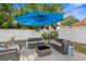 Private outdoor area with a lounge set, a sun umbrella, and a white vinyl fence at 3245 Freemont S Ter, St Petersburg, FL 33712