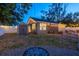 Backyard with a storage shed, gravel area, and inviting fire pit area at 3245 Freemont S Ter, St Petersburg, FL 33712