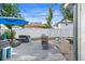 Charming backyard with wooden deck, outdoor seating, and stylish lighting at 3245 Freemont S Ter, St Petersburg, FL 33712