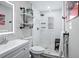 Modern bathroom with sleek fixtures, a glass-enclosed shower, and stylish shelving at 3245 Freemont S Ter, St Petersburg, FL 33712
